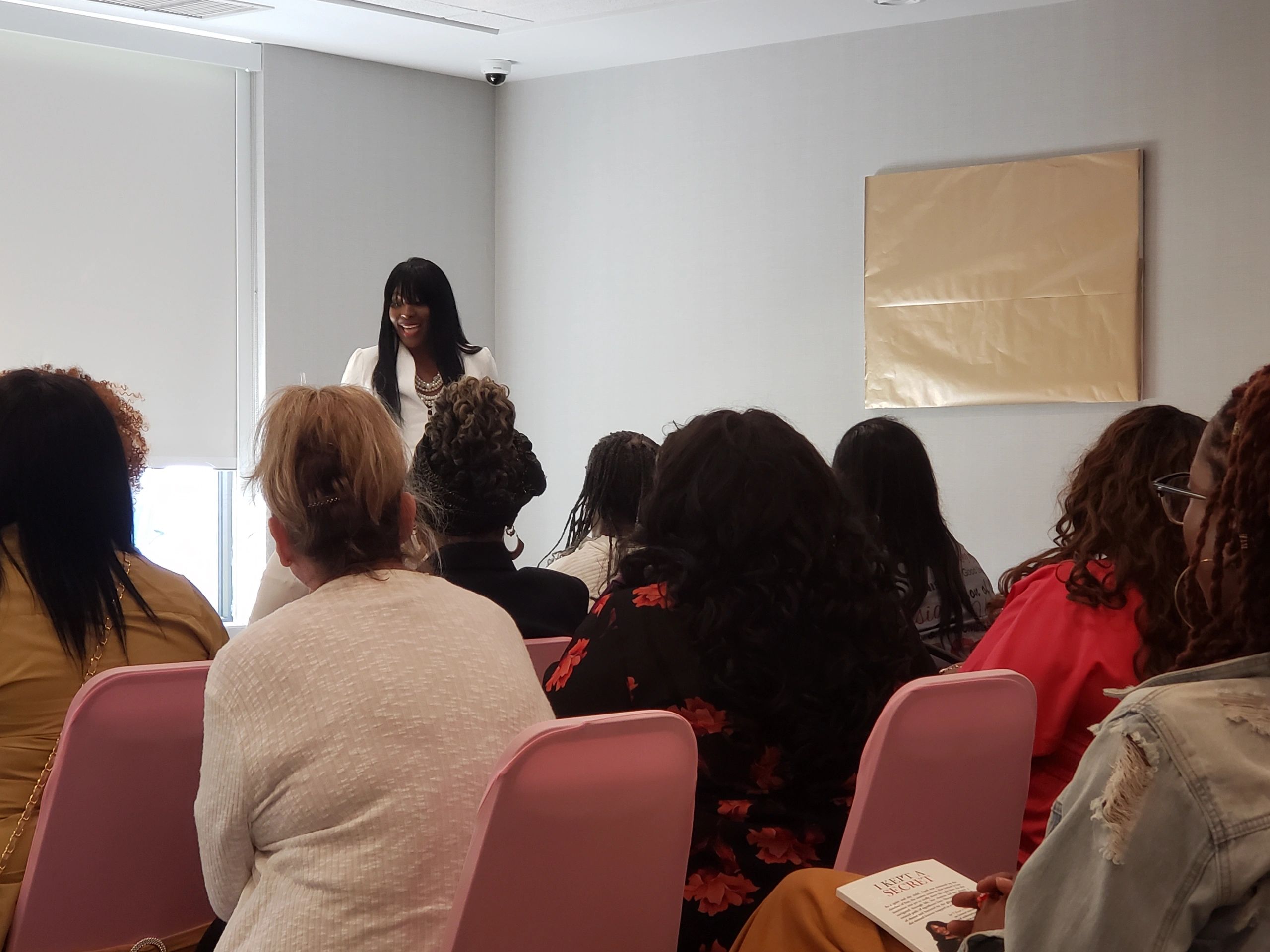 April Sams speaking at a conference